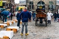 Traditional producers in Gouda Cheese Market a rainy day Royalty Free Stock Photo